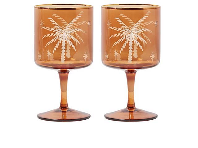 orange wine glasses on white background with palm tree design, goodhomesmagazine.com