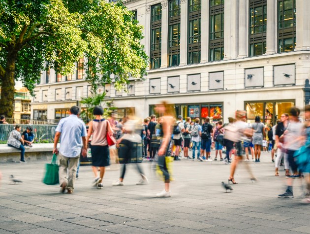 people walking in a busy square