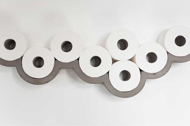 quirky concrete toilet roll shelf with toilet rolls on it - Bathroom storage ideas