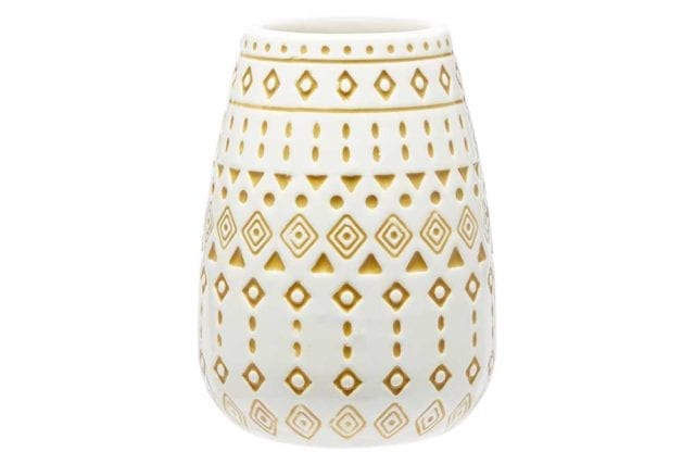 White tumbler with a yellow aztec tile print - Tile decor trends - Goodhomesmagazine.com