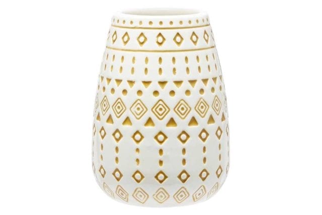 White tumbler with a yellow aztec tile print - Tile decor trends - Goodhomesmagazine.com