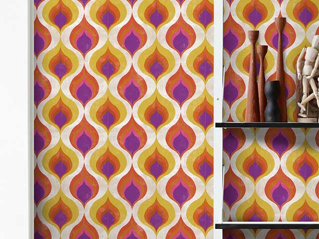 1970s style wallpaper with a yellow, pink and orange retro pattern - Instagram wallpaper trends - Goodhomesmagazine.com
