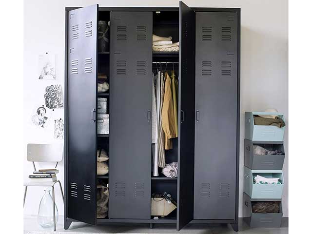 Black metal 4-door wardrobe with open doors showing hanging clothes on a rail - Metal storage lockers - Goodhomesmagazine.com