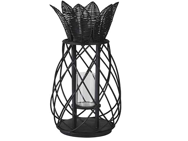Rattan lantern with flower shaped topper on white background, goodhomesmagazine.com