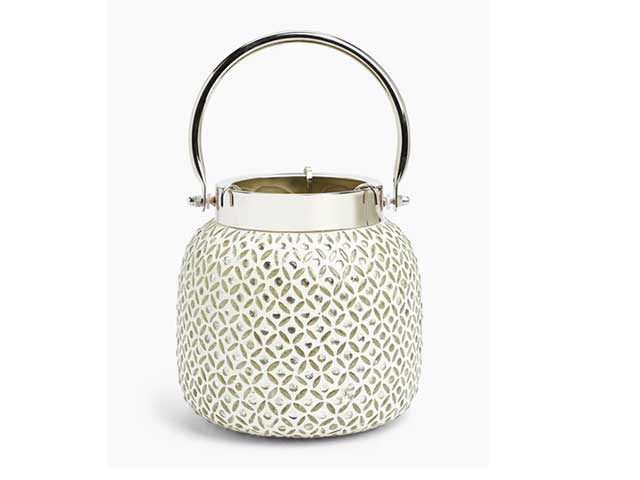 White beaded lantern with handle on white background, goodhomesmagazine.com