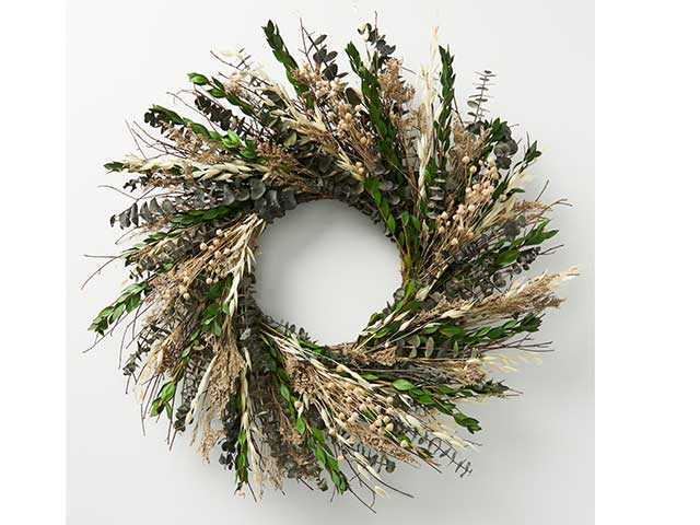 Dried flower wreath on white background