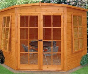 small wooden summerhouse with a pentagon roof and shiplap exterior 