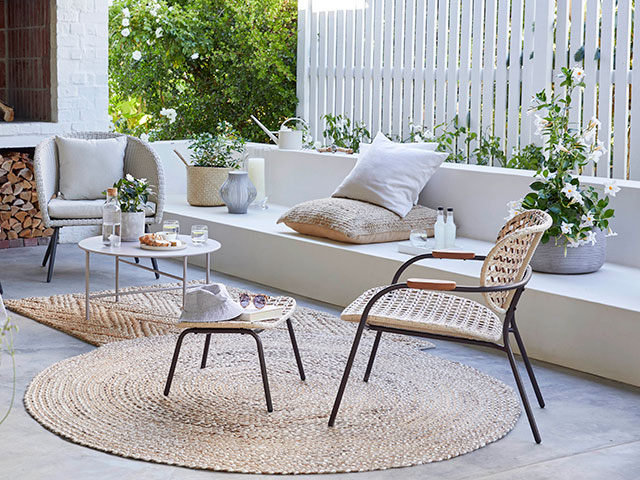 Best outdoor rugs: Scandi patio furniture with round jute rug from John Lewis