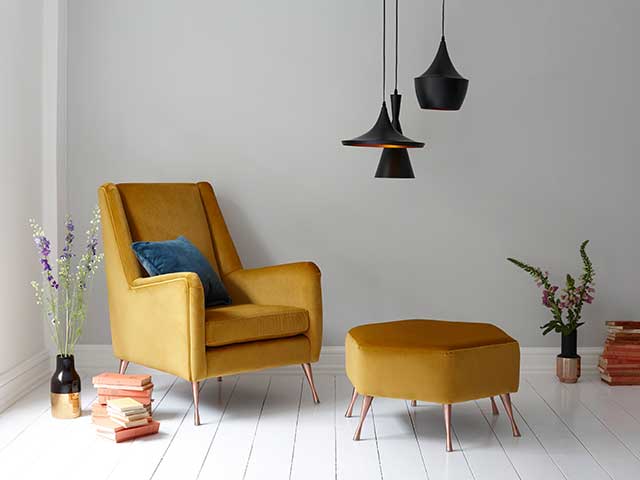 Yellow accent armchair with wooden pin legs and a matching footstool - Mid-century modern - Goodhomesmagazine.com