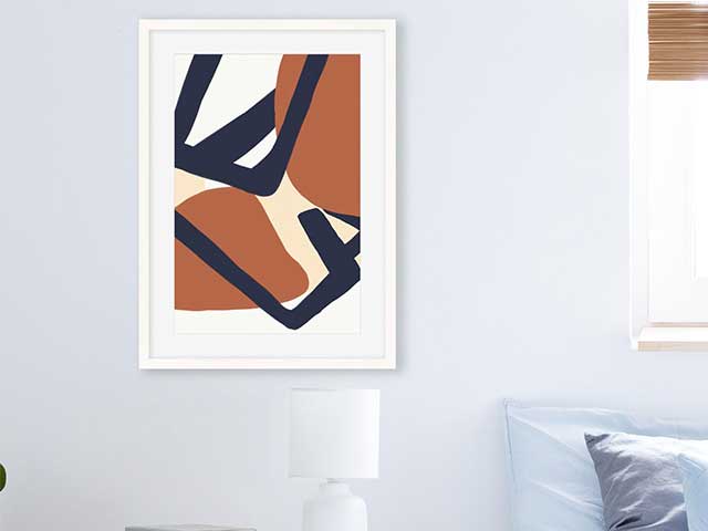 Abstract mid-century style print in a white frame on a wall - Mid-century modern - Goodhomesmagazine.com