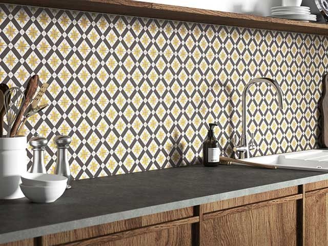 Geometric print yellow backsplash with wooden countertops - Mid-century modern - Goodhomesmagazine.com