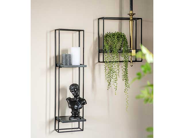 Long portrait black stylish shelfies with two levels holding candles and a small ornament, and smaller version beside with hanging plant and candlestick, goodhomesmagazine.com