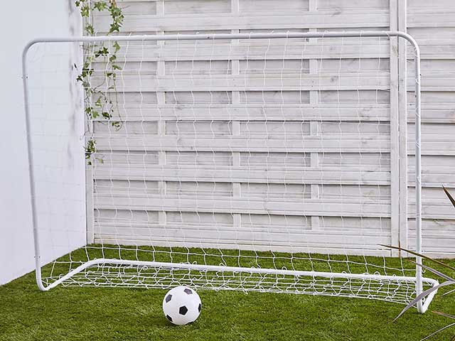 Goal post in back garden on artificial grass, goodhomesmagazine.com