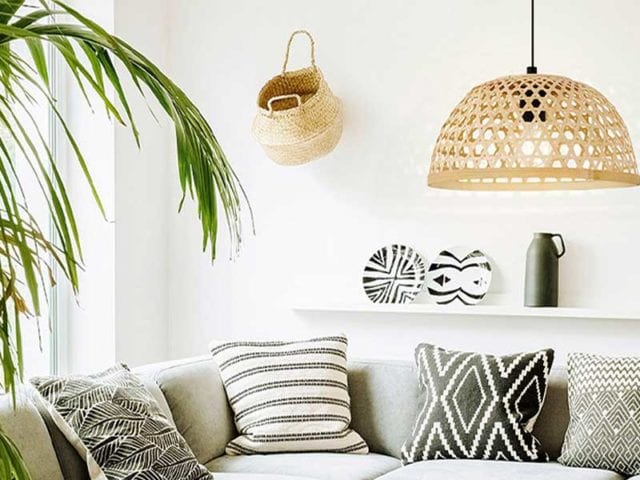 Woven rattan ceiling lampshade above a sofa in a living room - Living room lighting - Goodhomesmagazine.com