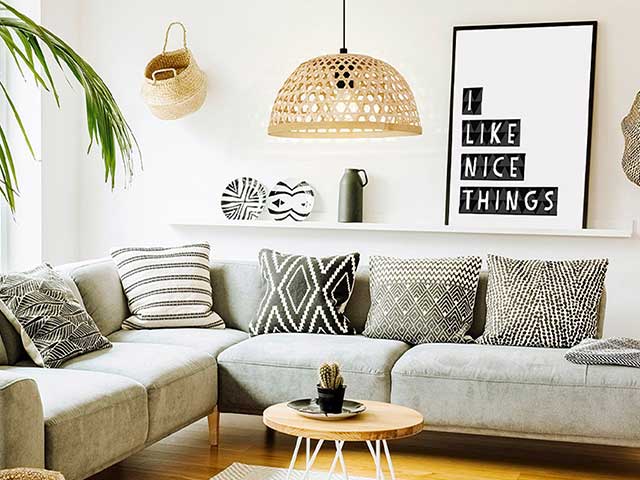 Woven rattan ceiling lampshade above a sofa in a living room - Living room lighting - Goodhomesmagazine.com