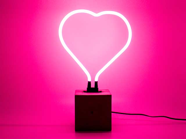 Pink heart neon table lamp with a concrete stand on a pink background - Neon lights - Goodhomesmagazine.com