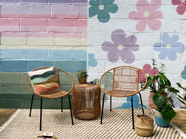 Holiday wall with bright pastel rainbow colours and flowers in Brighton 