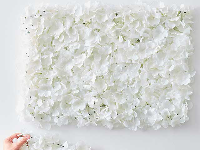 White faux flower wall art inspired by Stacey Solomon's pink nursery