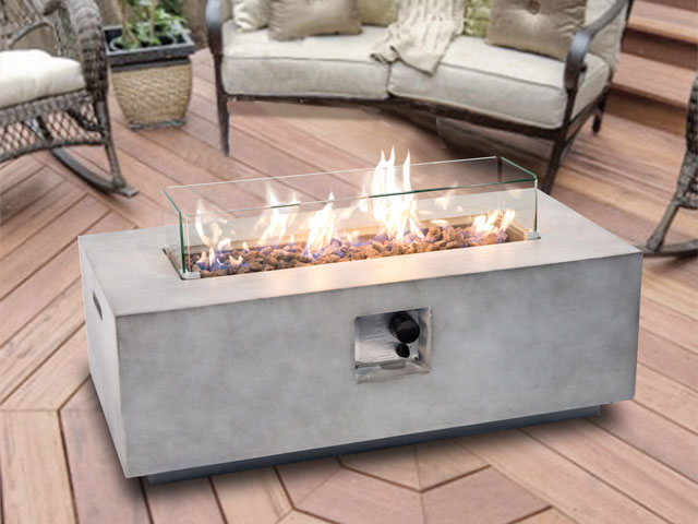 concrete gas fire pit table on a decked area with garden furniture