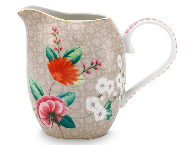 Floral and bird printed milk jug in cream on white background