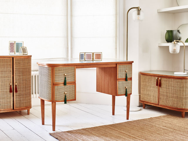 Oliver Bonas rattan desk paired with seagrass rug for a tropical home office
