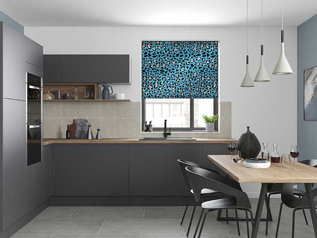 Blue animal print roller blind in grey kitchen diner space