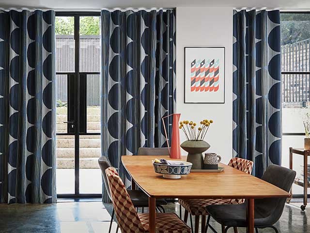 Margo Selby x Hillarys navy patterned full length curtains in dining room