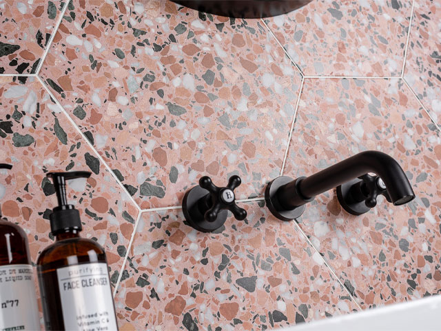 Pink hexagon terrazzo bathroom tiles from walls and floors