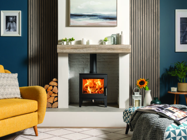 mix of modern and traditional decor with traditional fireplace surrounded by wall panels