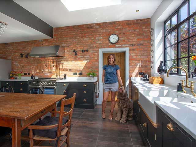 Alouisa in Industrial style kitchen with labradoodle