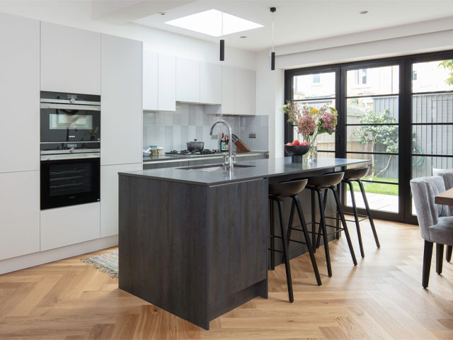 Kitchen extension with large folding doors in a period terrace in west London