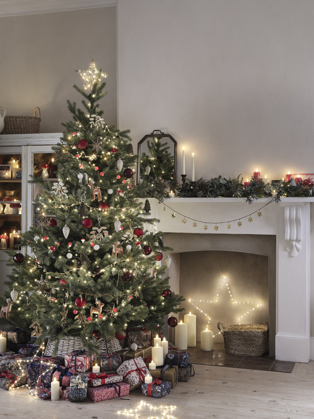 Christmas tree by the fireplace