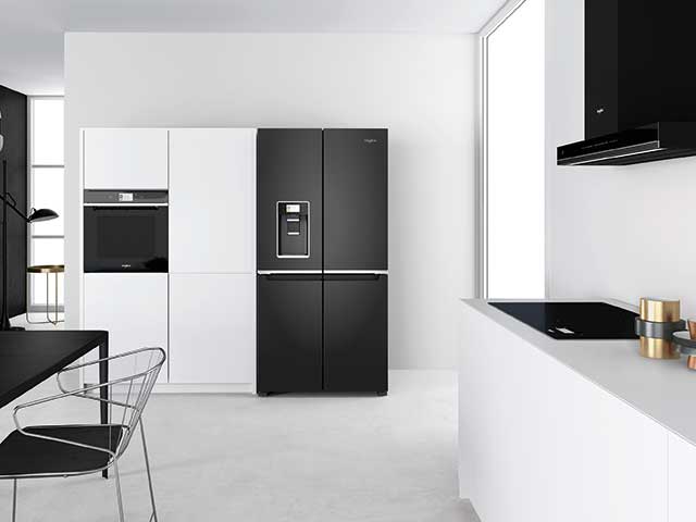 Black and white kitchen with black fridge freezer