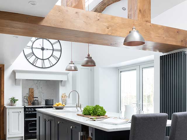 Wooden beams in centre of modern country style kitchen