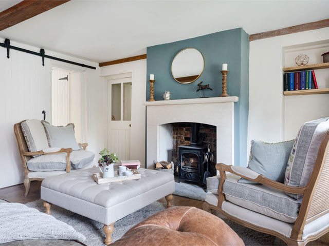 cottage living room decor ideas: the original fireplace is the centrepiece of the room
