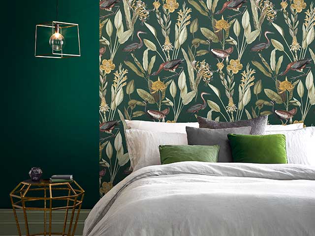 jungle print wallpaper in forest green with herons and plants