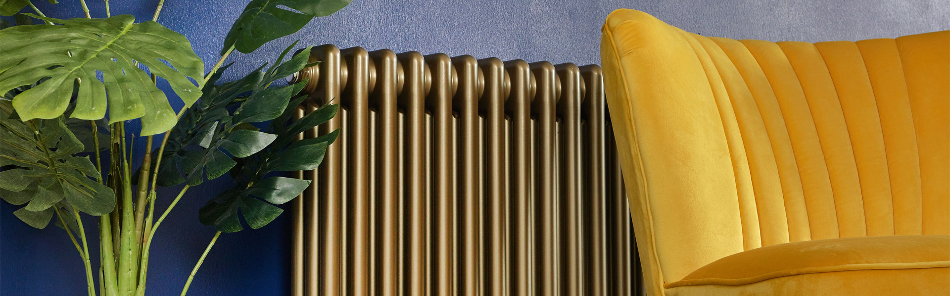 gold radiator with yellow accent chair and green plant