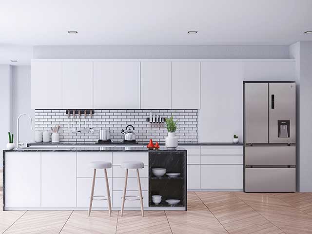 White kitchen with silver fridge freezer
