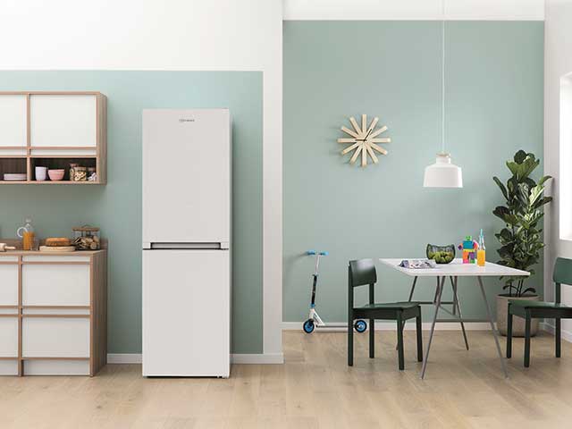 Fridge freezer in kitchen diner space with laminate floor