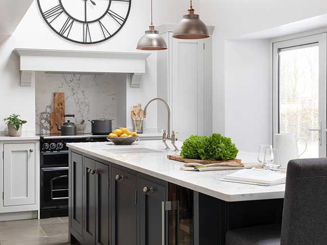 Modern country style kitchen with island, built-in sink and range cooker