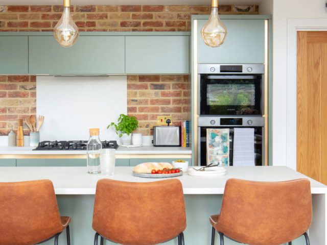 new-build kitchen remodelled with new cabinets and faux brickwork