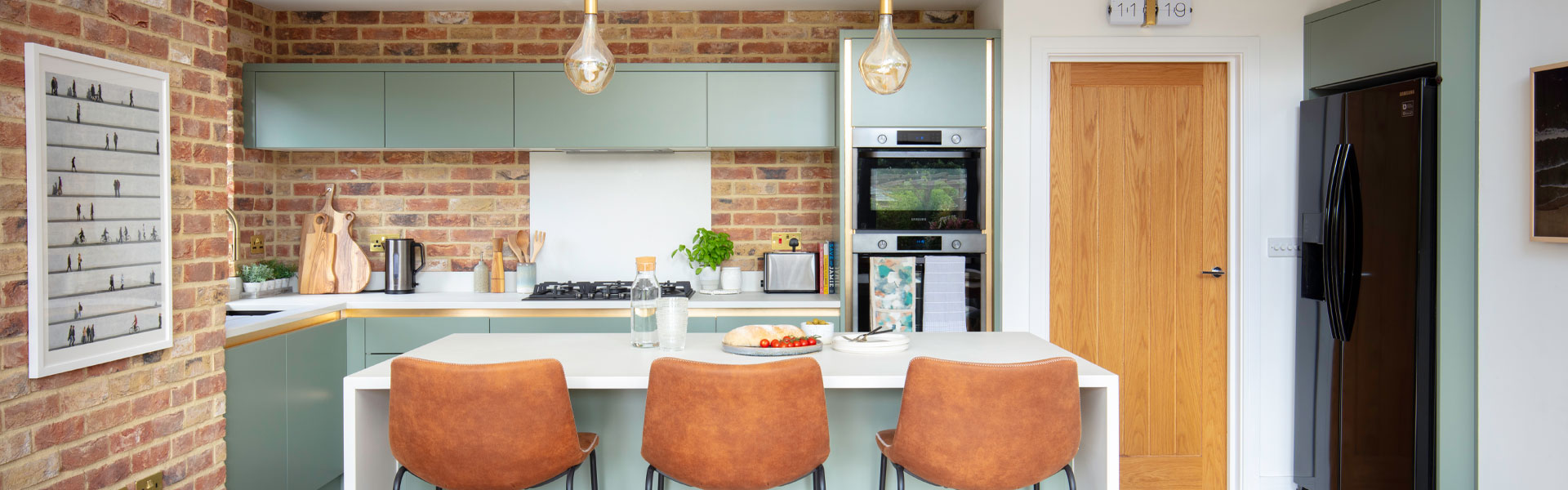 new-build kitchen remodelled with new cabinets and faux brickwork