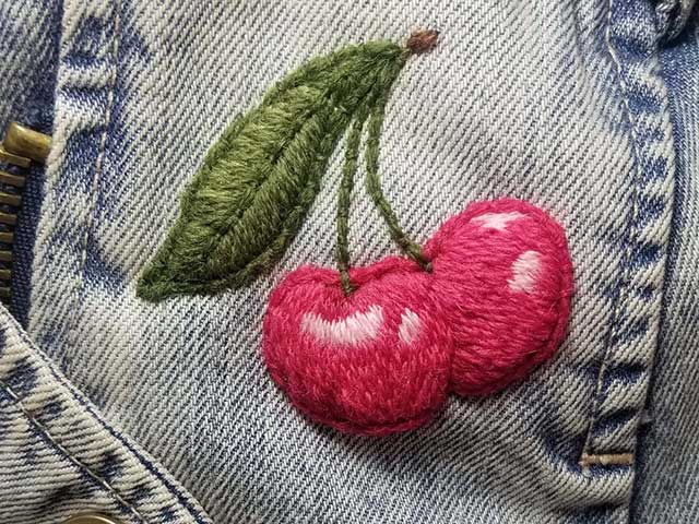 cherry on denim pocket