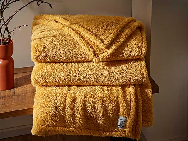 Mustard yellow blanket stash from Dunelm Teddy range