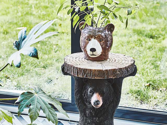 Bear ornament in front of bifold doors leading to garden