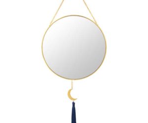 Gold mirror with half moon hanging down on white background