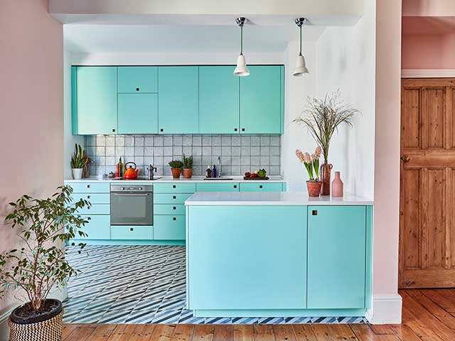 Turquoise cabinets in Miami style colourful kitchen