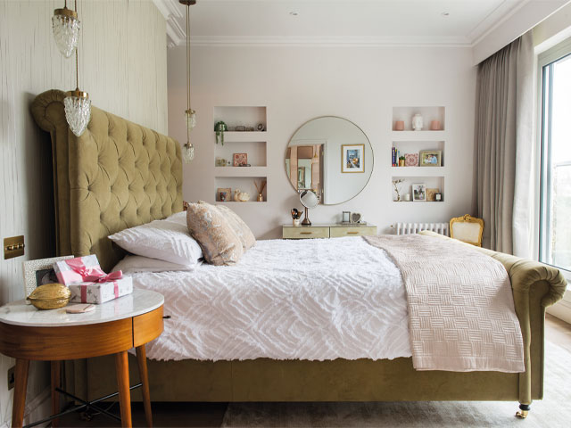 reconfigured master bedroom suite in a period property with pale walls and large sleigh bed