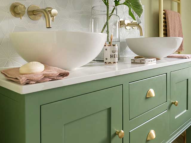 Green bathrooms vanity unit with white basins