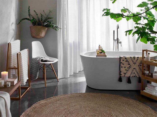 bohemian bathroom with large round jute rug, boho bathmat and bathscaping